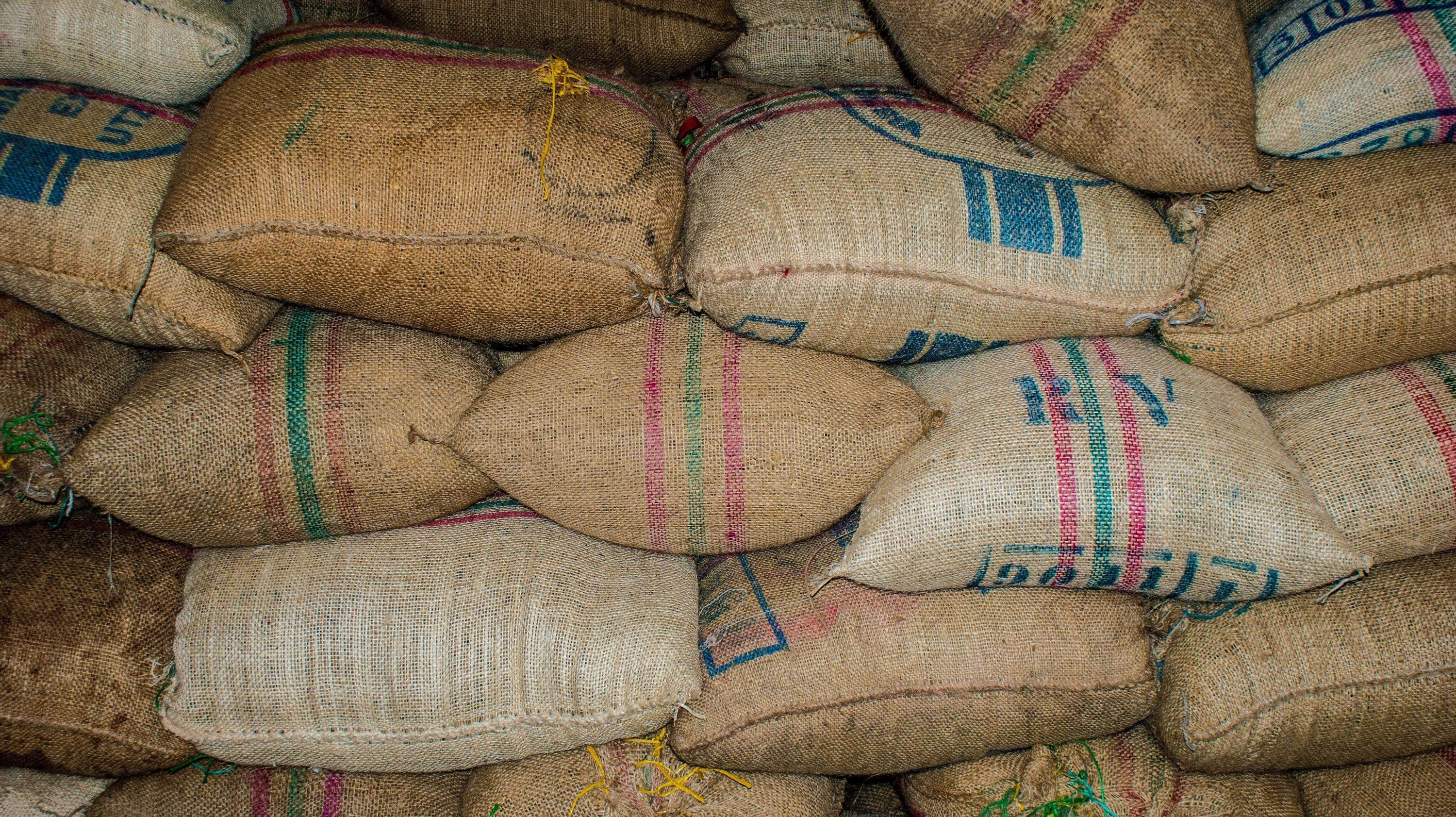 From Bean to Cup: Discover the Flavourful Benefits of Ethical Sourcing with Rajado Coffee - burlap sacks of coffee beans