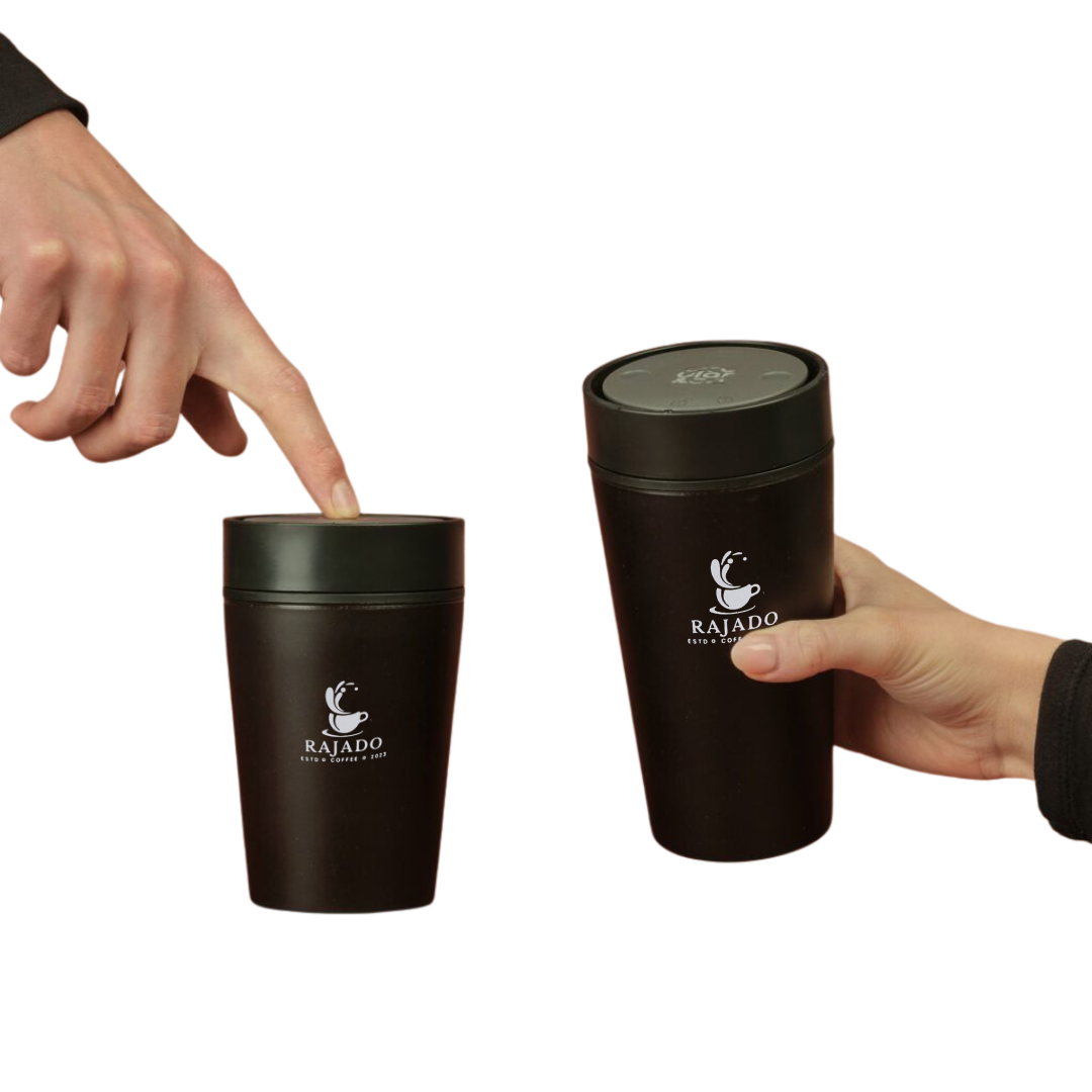 reusable coffee cup from coffee waste shown in hands, highlighting its sustainable design and practicality.