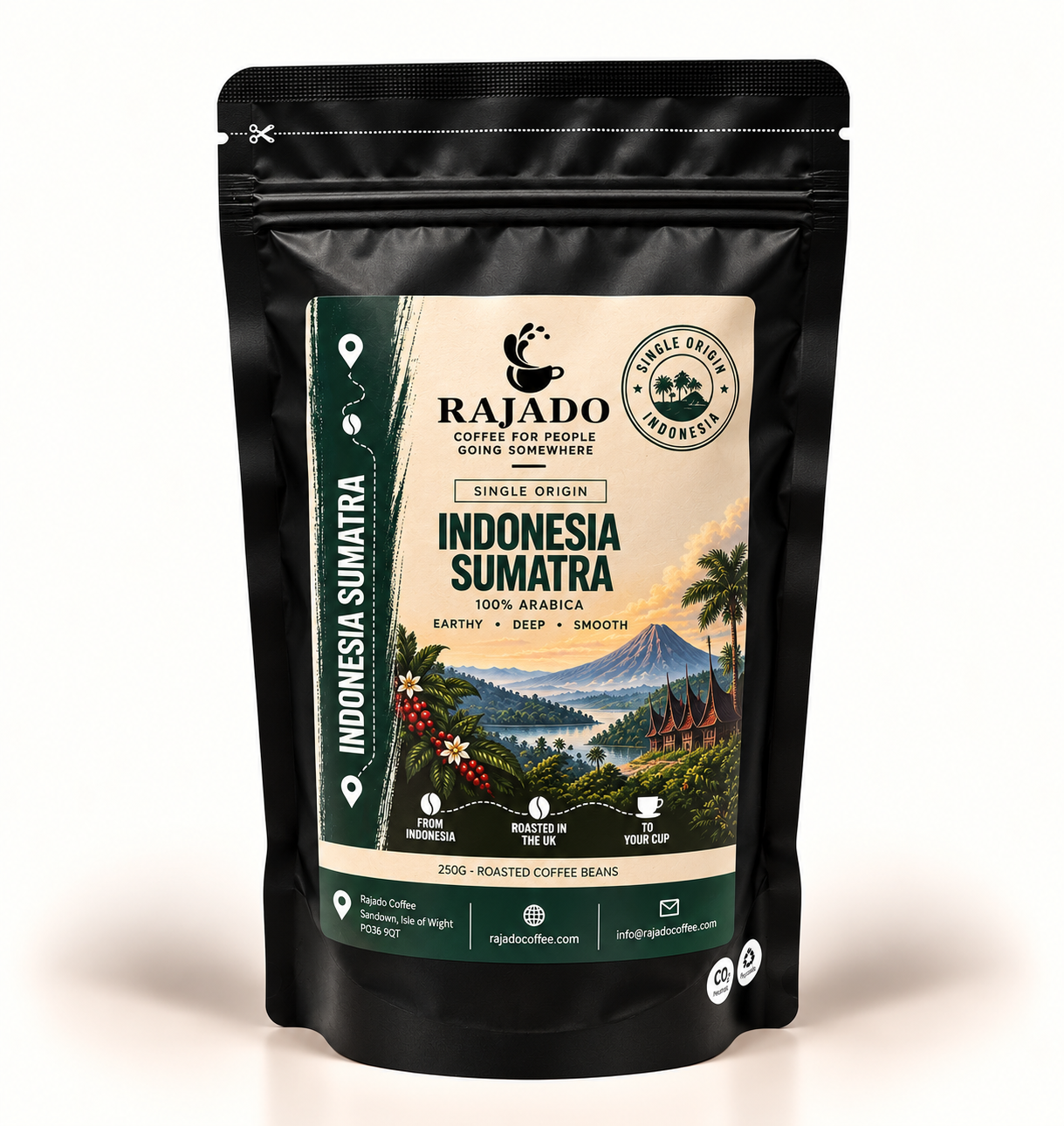 A black stand-up pouch of Rajado Coffee Roasted Single Origin Indonesia Sumatra coffee beans, featuring a detailed label with a mountain and tropical landscape illustration.