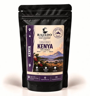A black stand-up resealable pouch of Rajado Coffee Kenya single-origin coffee beans, featuring a detailed label with a landscape illustration and product details, set against a plain white background.