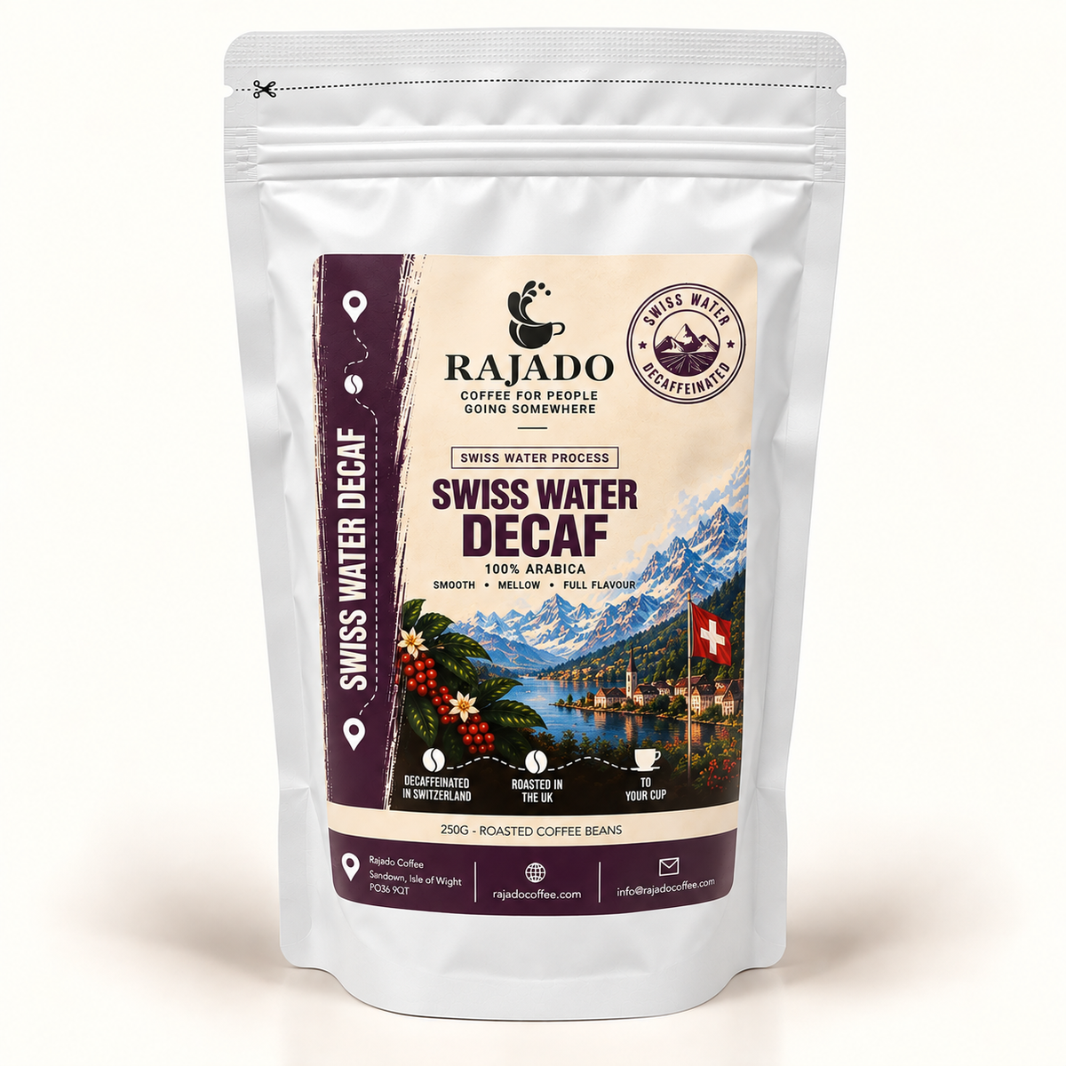 A stand-up resealable pouch of Rajado Swiss Water Decaf coffee beans on a clean white background. The packaging is silver with a large front label featuring a cream background, dark purple side panels, and a scenic Swiss mountain-and-lake illustration.