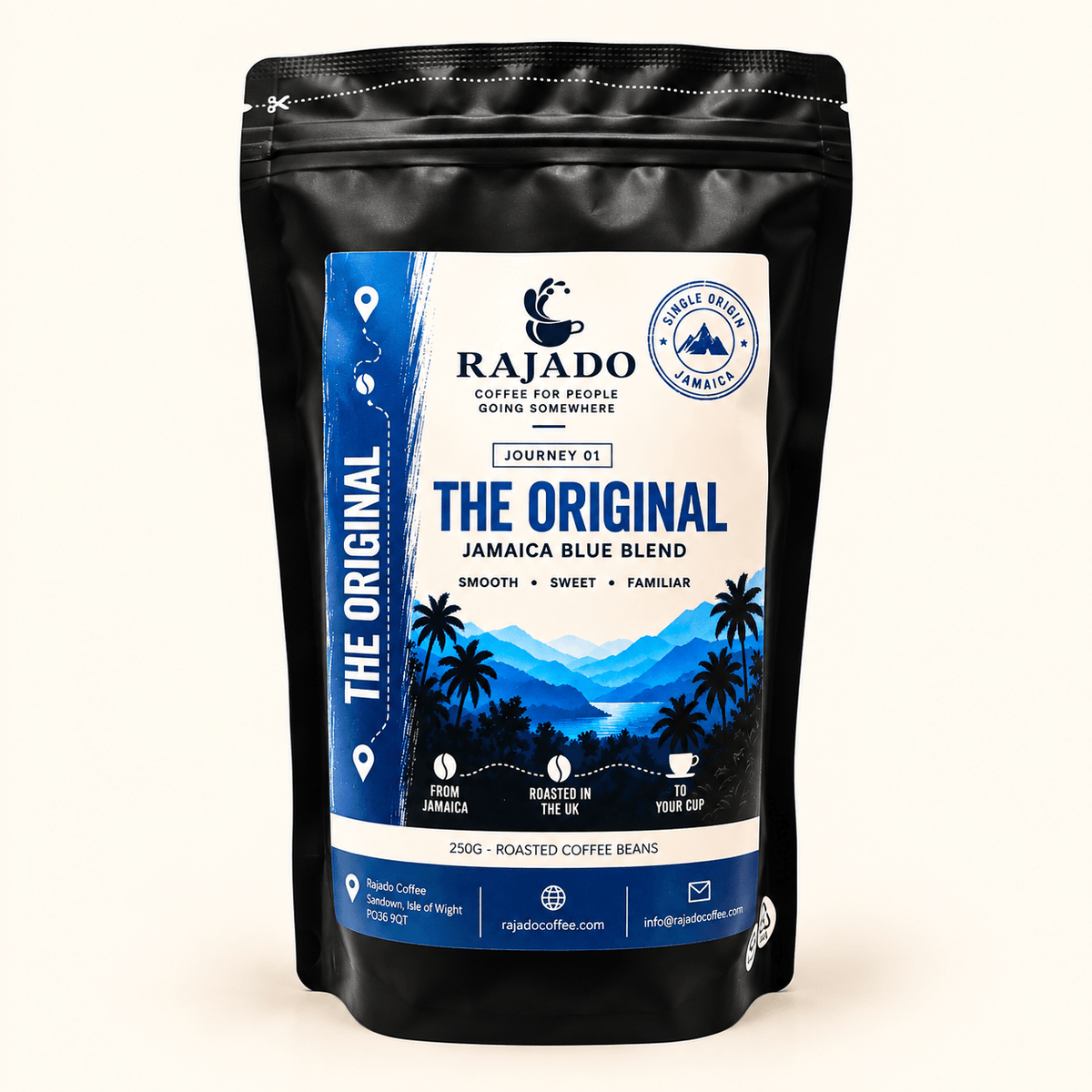 A black stand-up pouch of Rajado Coffee 'The Original' Jamaica Blue Blend coffee beans, featuring a blue and white label with a mountain and palm tree graphic, set against a plain off-white background.